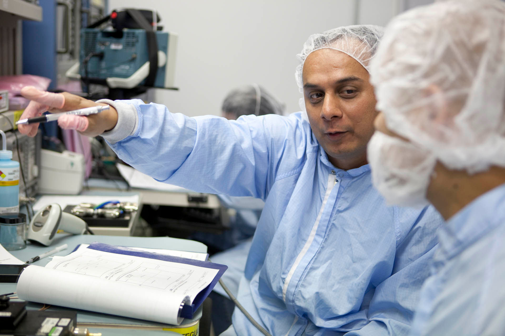 Clean room workers, testing a cochlear implant